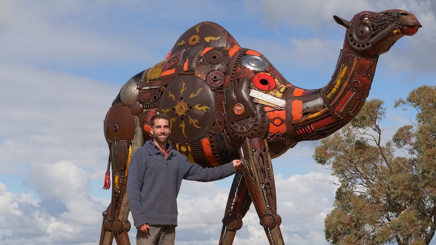 Jordan Sprigg with his life-size camel sculpture