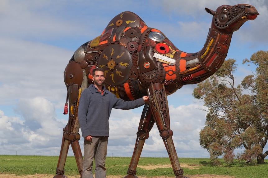 Jordan Sprigg with his life-size camel sculpture