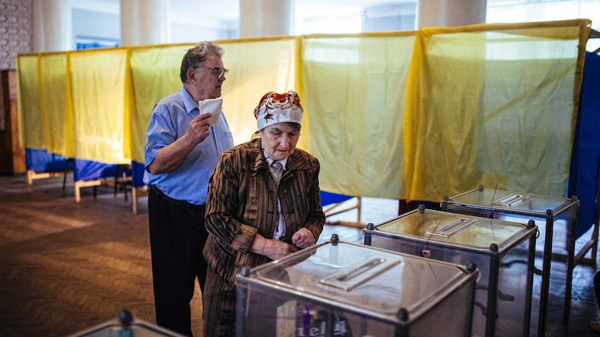 A man and woman cast their ballots