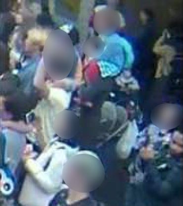 A CCTV image showing David James taking a picture of a minor which he later uploaded to the internet.