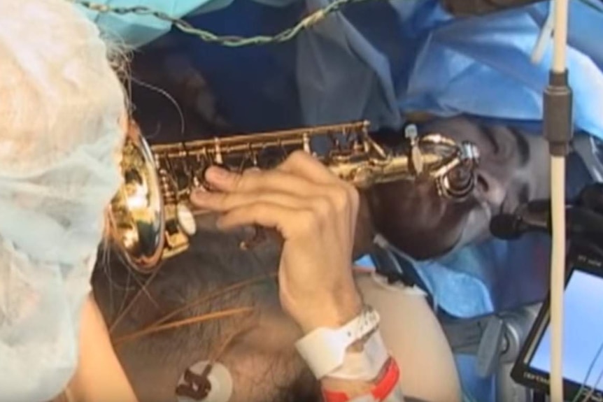 Dan Fabbio plays the saxophone while undergoing brain surgery.