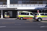 Several ambulance vehicles parked outside Cairns Hospital.