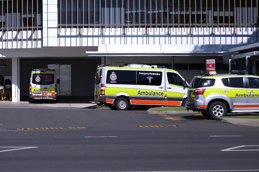 Several ambulance vehicles parked outside Cairns Hospital.