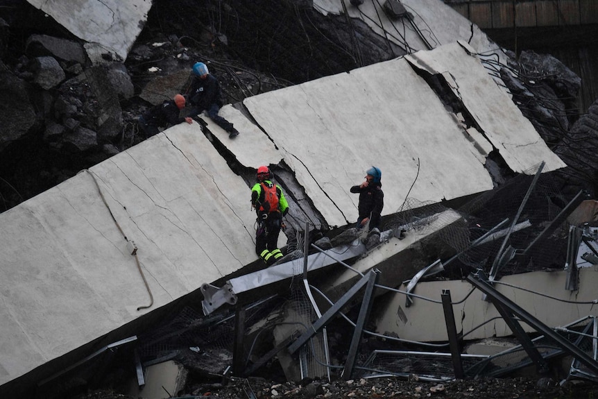 Rescue workers in Genoa following bridge collapse