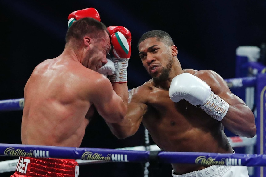 Anthony Joshua lands an upper cut to the face of Kubrat Pulev