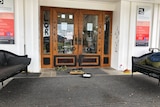 A picture of doors with black paint on 