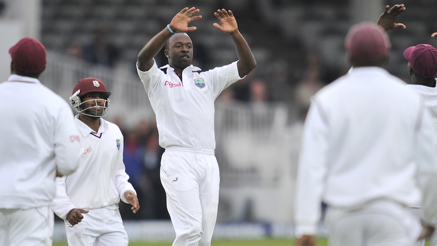 West Indies fast bowler Kemar Roach takes a vital wicket in the First Test against England.