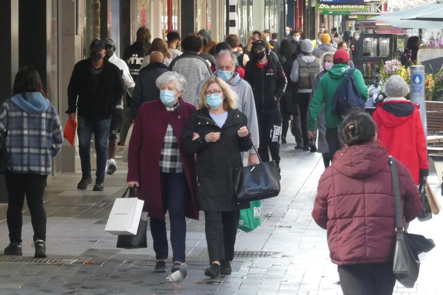 Pedestrians wearing masks in Adelaide's Rundle Mall.