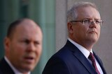 Scott Morrison looks into the distance while listening to Josh Frydenberg at a joint press conference