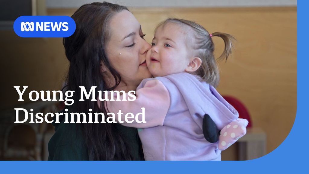 Young Mums Discriminated: A woman kisses the cheek of a toddler while holding her.