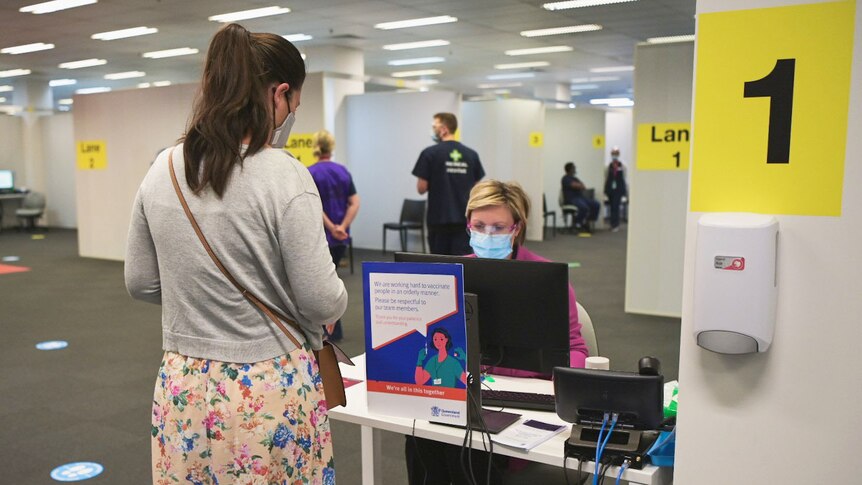 Woman checks in for a COVID-19 vaccination at Ipswich hub, west of Brisbane on October 6, 2021.