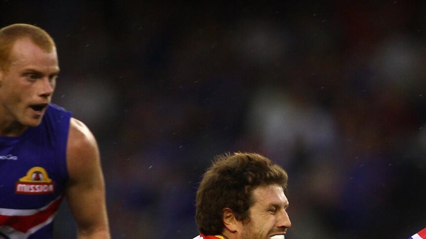 Campbell Brown (centre) will sit out the Suns' next four matches.