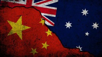 China and Australian flags superimposed on cracked earth