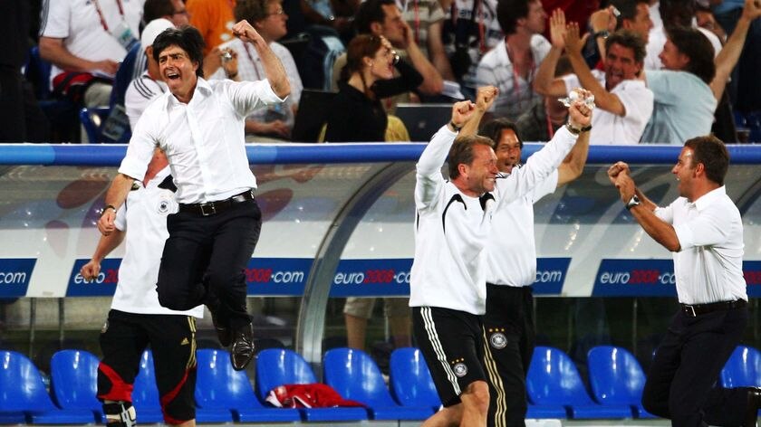 Coach of Germany, Joachim Loew, leaps in the air