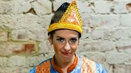 An Australian woman wearing a traditional dress of Aceh, Indonesia