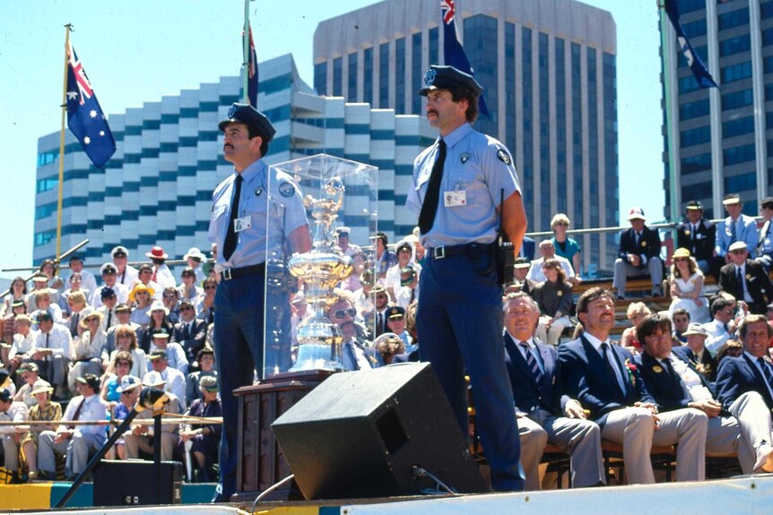 Police guard the America's Cup during celebrations for Australia's 1983 victory.