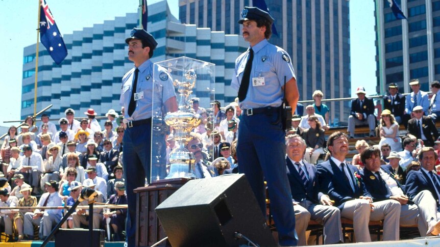 Police guard the America's Cup during celebrations in Perth
