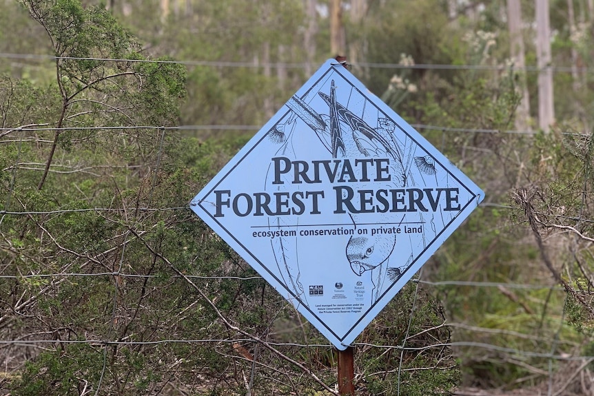 A wildlife sign reading: private forest reserve
