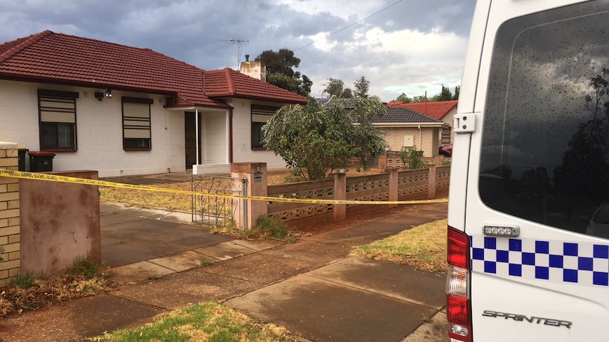 A house with police van parked out the front