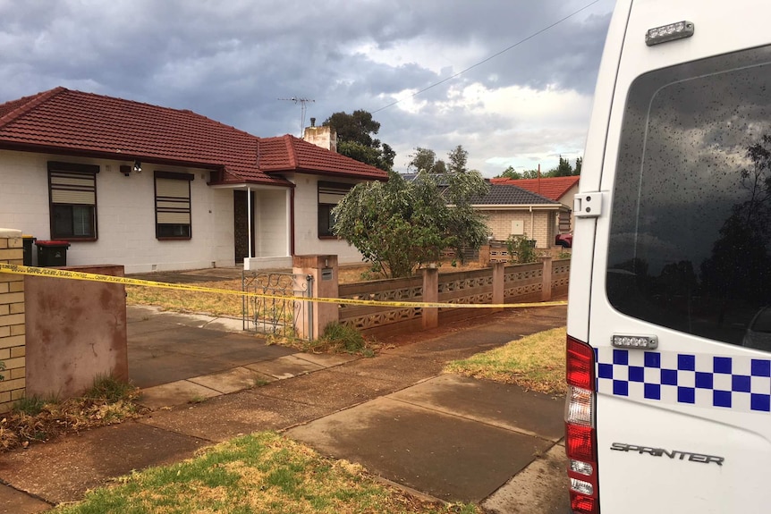 A house with police van parked out the front