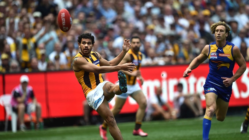 Cyril Rioli kicks Hawthorn's first goal against West Coast in the 2015 AFL grand final at the MCG.