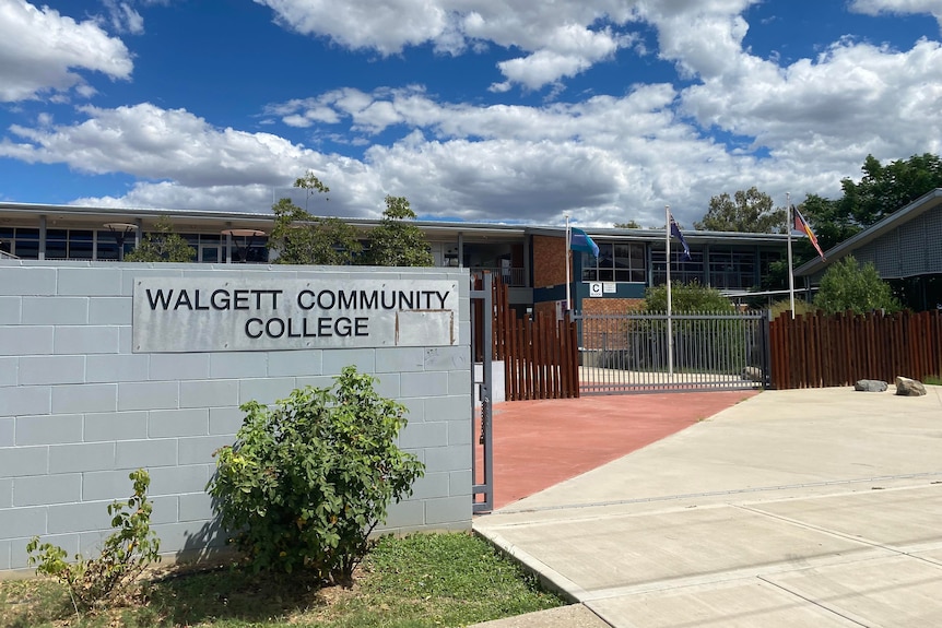 A brick high school with a sign saying "Walgett Community College".
