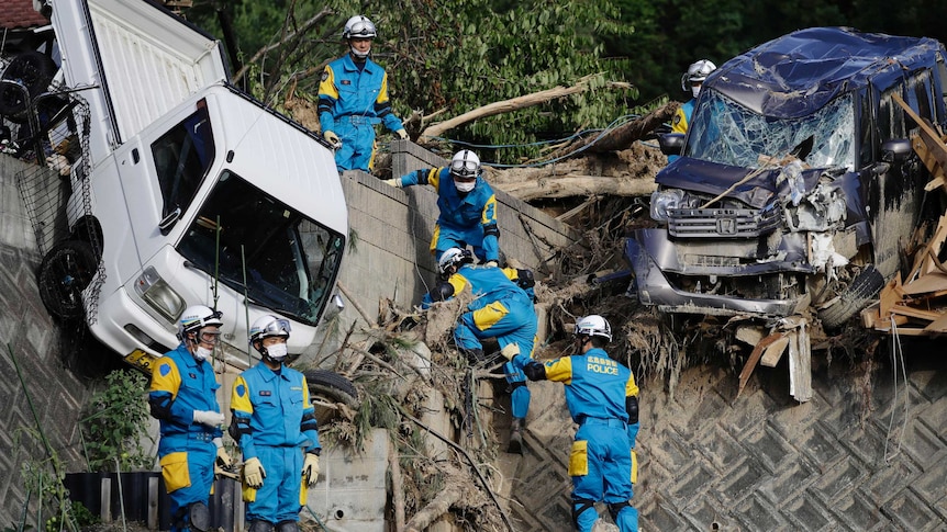 Rescuers search for missing people at a mudslide site