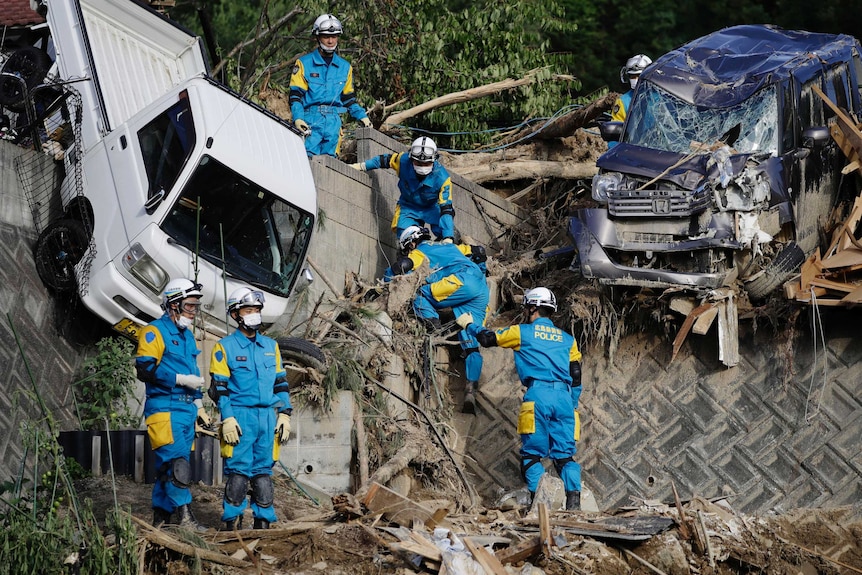Rescuers search for missing people at a mudslide site