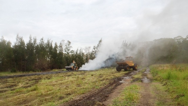 Work is underway to extinguish a slow burning coal fire in the former Wallarah colliery at Crangan Bay.