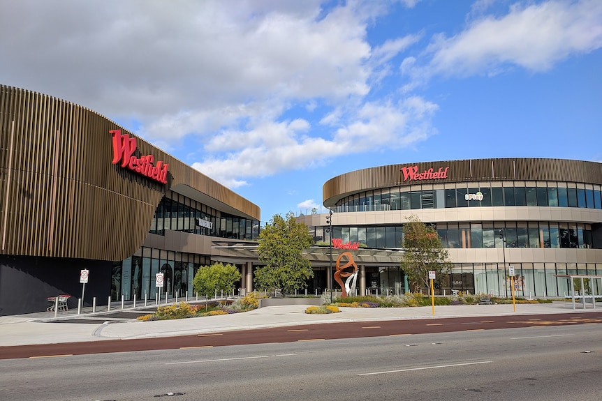 A large shopping centre building with the name Westfield on the outside. 
