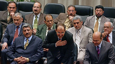 Iraqi Prime Minister Nuri al-Maliki smiles during the inauguration of the national unity government.