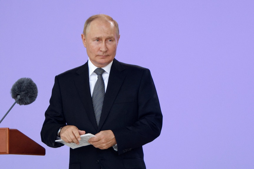 Russian President Vladimir Putin speaks at a conference. 