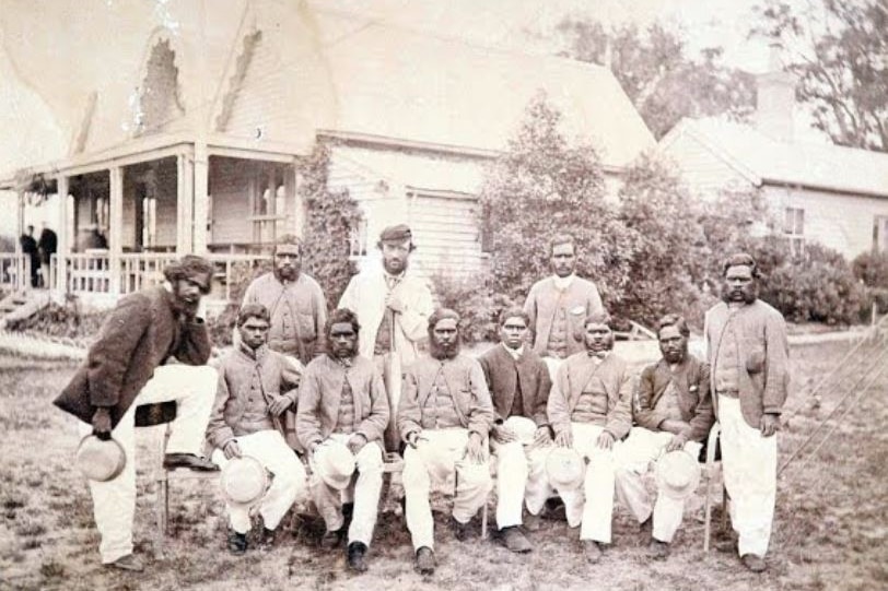 A black and white image of the first Aboriginal cricketers with Tom Wills.