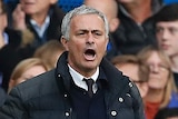 Jose Mourinho looks on during United's loss to Chelsea