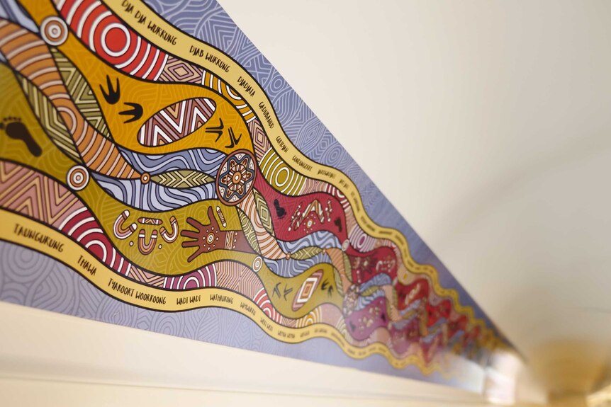 Indigenous artwork on the ceiling of train.
