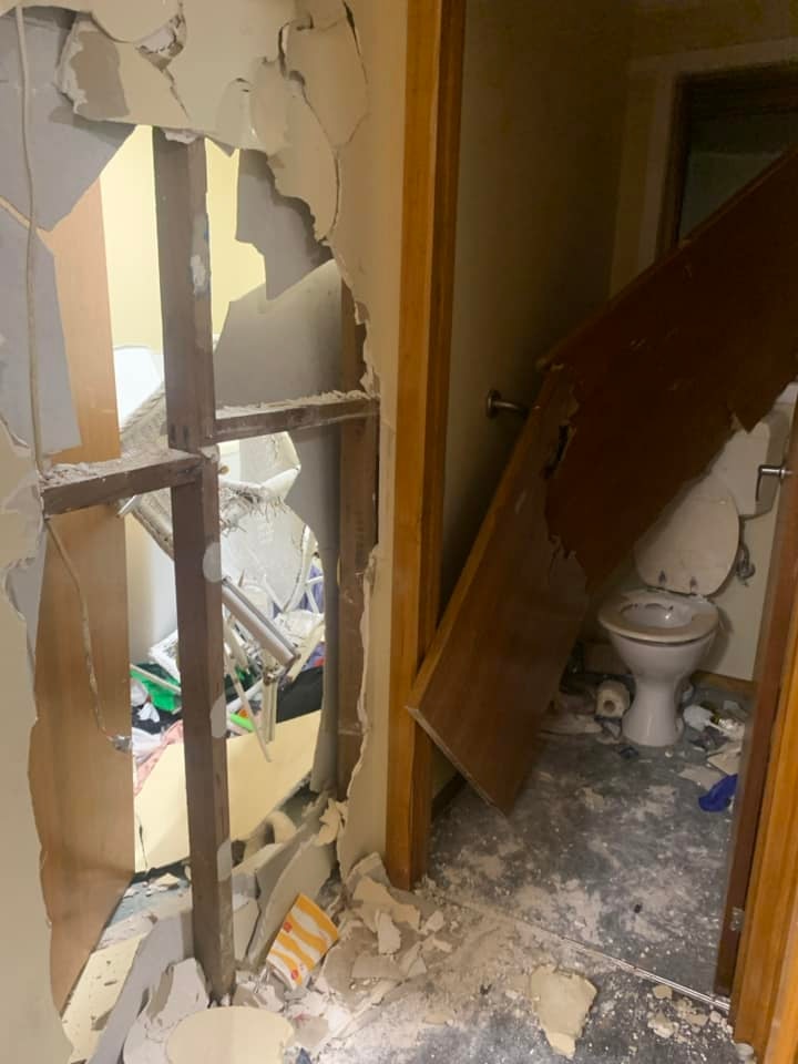social housing unit - toilet and walls wrecked