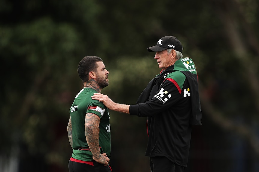 NRL coach talking with one of his players at training