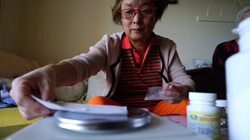 Wang Jie makes her own cancer drugs in her home