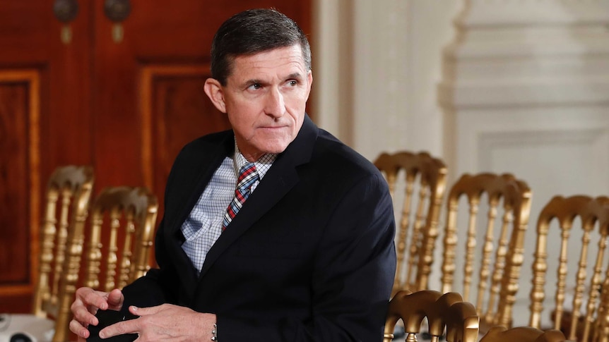 Michael Flynn sits in the East Room of the White House.