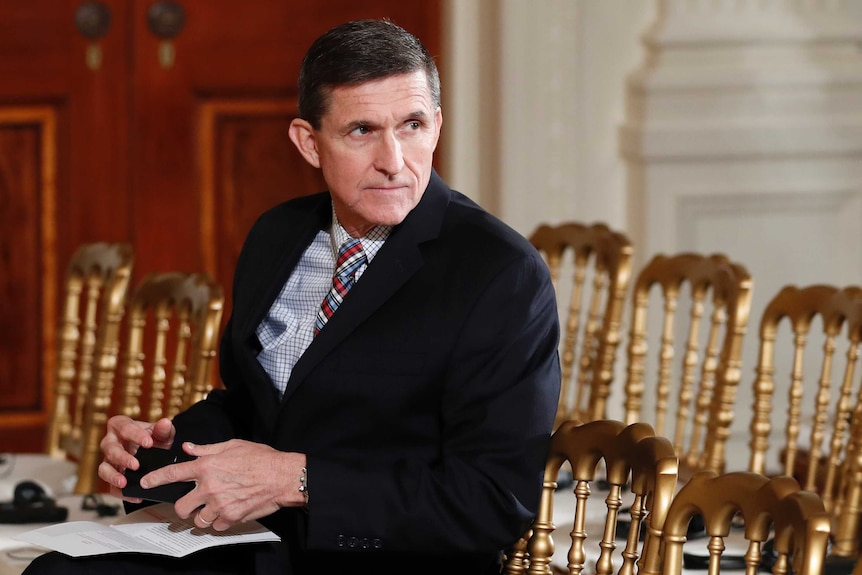 Michael Flynn sits in the East Room of the White House.