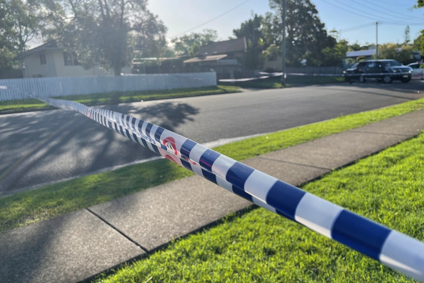 House with police tape across the road