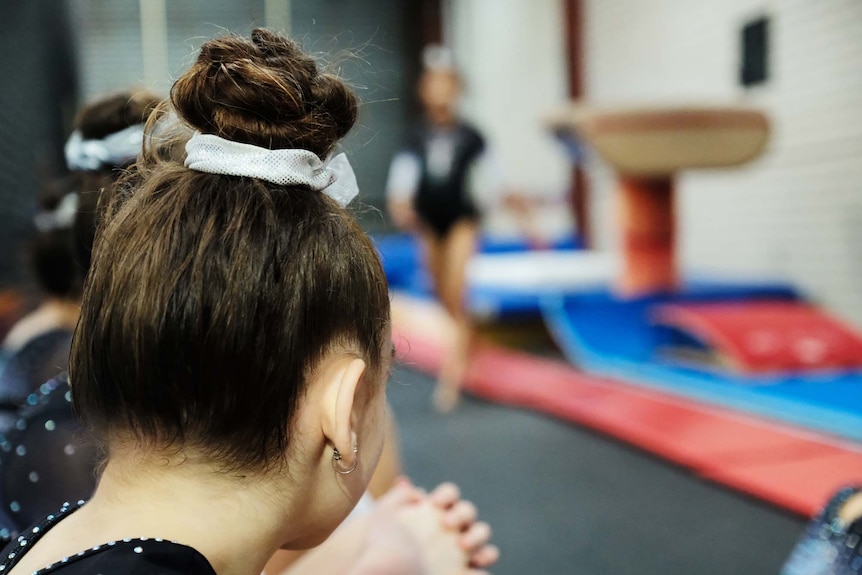 A gymnast trains