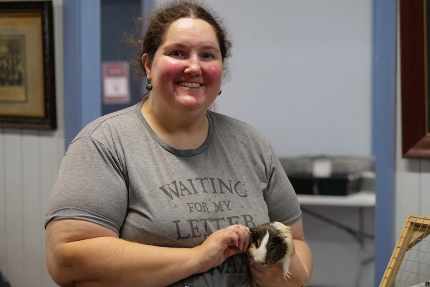 A woman with a guinea pig