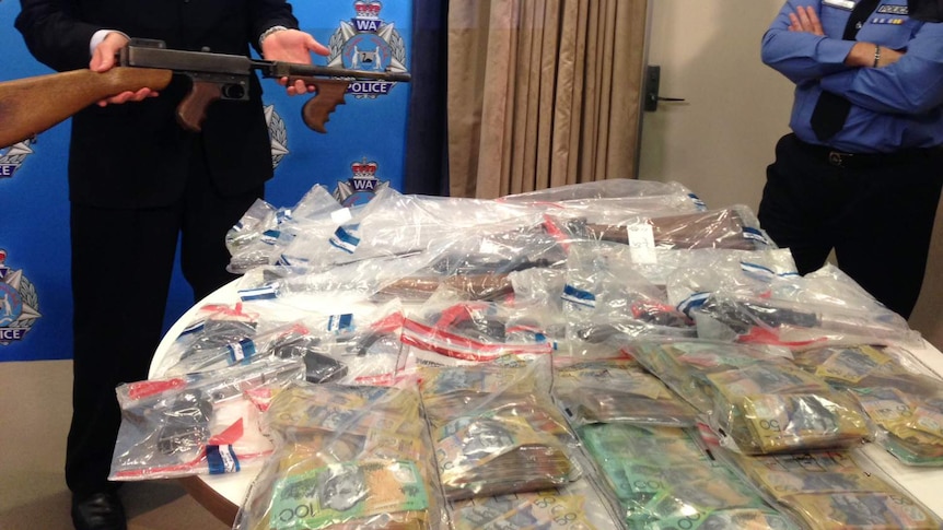 A seizure of cash, drugs and firearms seized by police