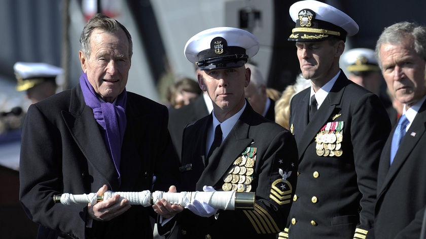 Mr Bush called the Nimitz-class carrier 'an awesome ship' that honoured 'an awesome man.'