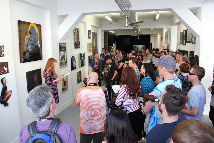 Crowd at an art show.