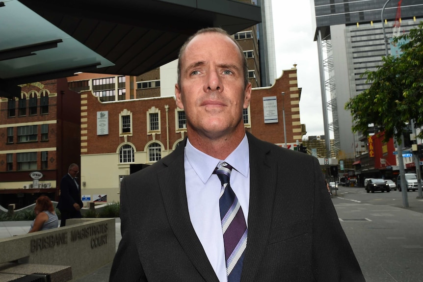 Senior Constable Stephen Flanagan leaves the Magistrates Court in Brisbane