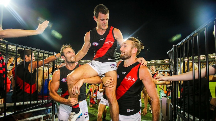 Brent Stanton carried off by team-mates