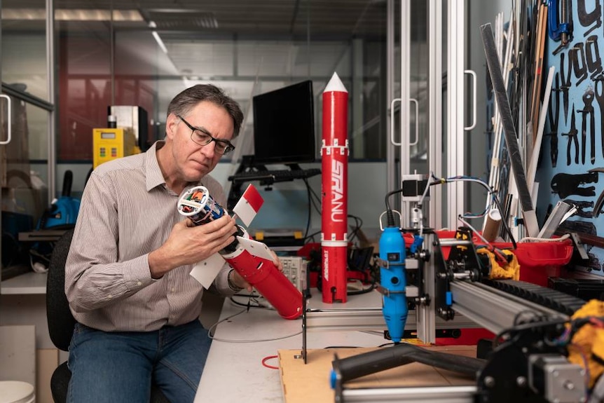 Professor Robert Mahony with a prototype water glider