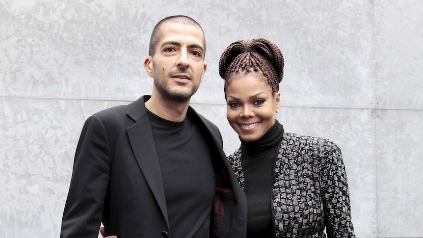 Wissam Al Mana stands with his arm around the waist of Janet Jackson in Milan.